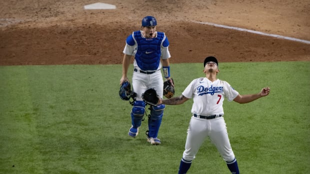 Oct 18, 2020; Arlington, Texas, USA; Los Angeles Dodgers starting pitcher Julio Urias (7) and catcher Will Smith (16) celebrate defeating the Atlanta Braves in game seven of the 2020 NLCS at Globe Life Field. Mandatory Credit: Jerome Miron-USA TODAY Sports
